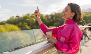 pretty sportive woman bright pink jacket walking early marning outdoor min